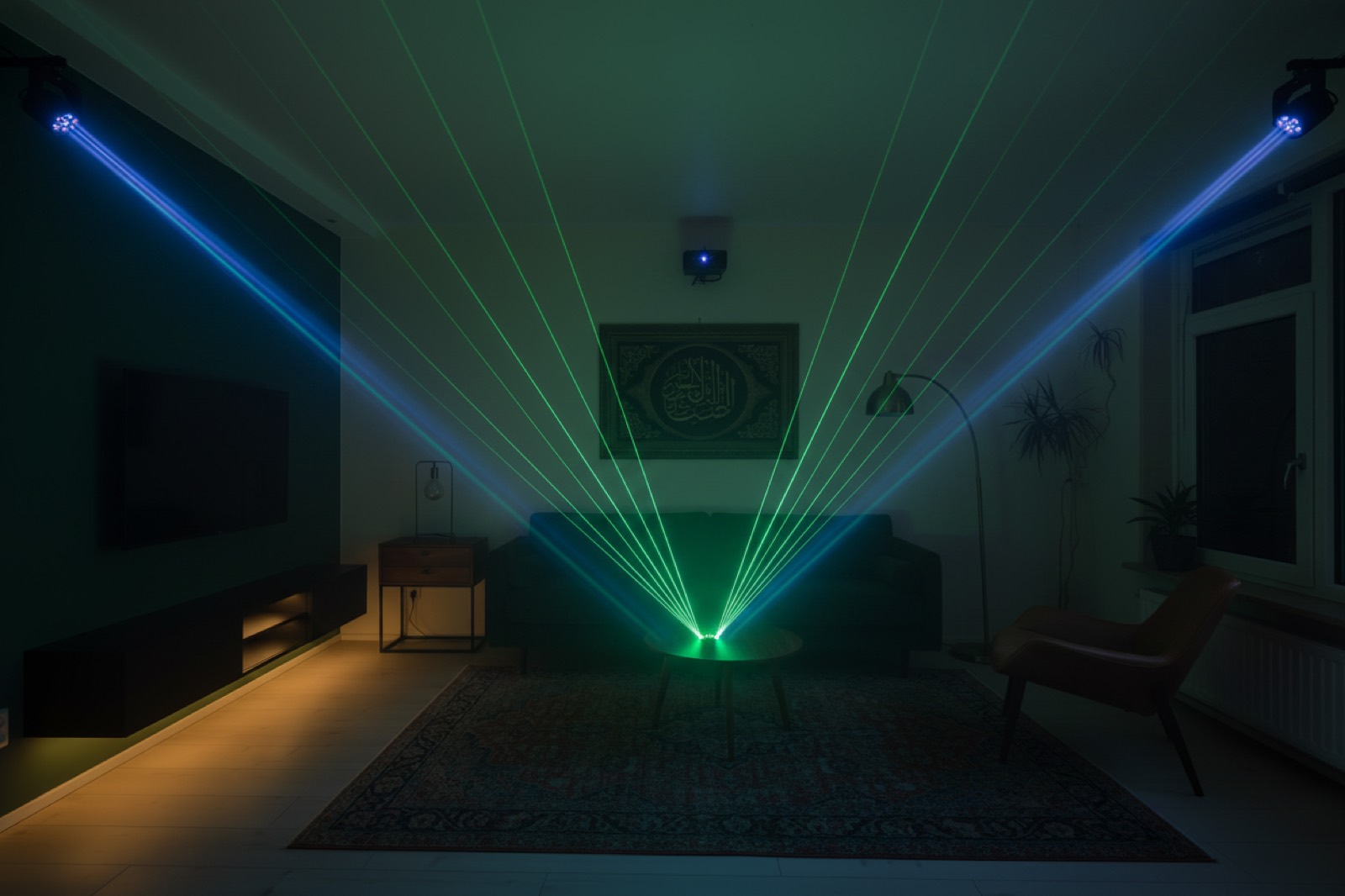 Living room in party mode: two moving-head spots and a laser tunnel through haze